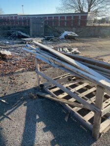 A pile of wooden planks and various yard debris ready for removal by The Removal Squad LLC in Orlando, FL.