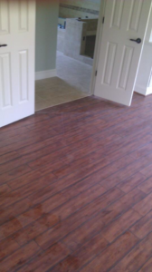 A seamless wood to tile floor transition in a home by Cliff's Construction in Richmond, VA.