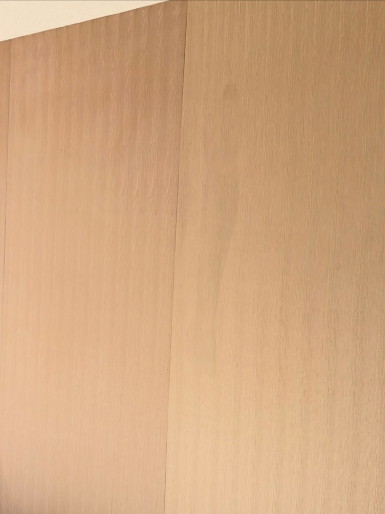 Close-up detail of wood wall paneling, ready for finishing by Bespoke Finish in Minneapolis, MN.