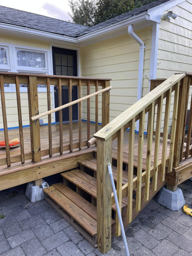 Professional installation of a wooden deck with stairs by Digby Handyman Services LLC in Cranston, RI.