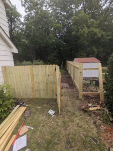 New wooden fence installation by My Handyman of Wichita KS, providing outdoor services in Kechi, KS.