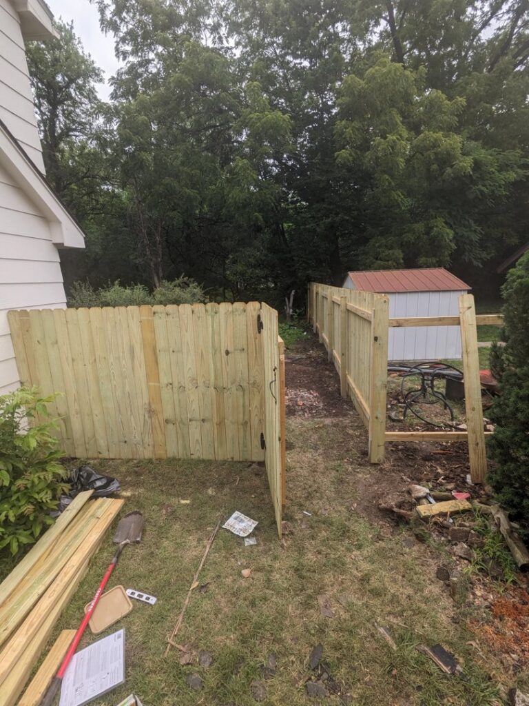 New wooden fence installation by My Handyman of Wichita KS, providing outdoor services in Kechi, KS.