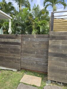 A newly installed or repaired wooden fence, showcasing outdoor work by Just-In-Time Handyman Services in Honolulu, HI.