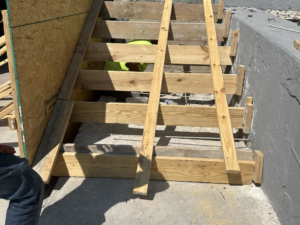Wooden forms set up for pouring new concrete stairs by R&A Concrete Home Solutions LLC in Appleton, WI.