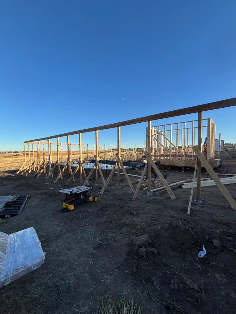 Wooden framing for a new structure under construction by Blue Collar Service Pros in Aurora, CO.