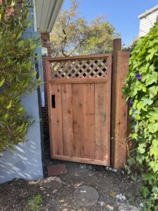 A newly installed wooden gate with lattice work by Kennyman The Handyman Inc. in San Francisco, CA