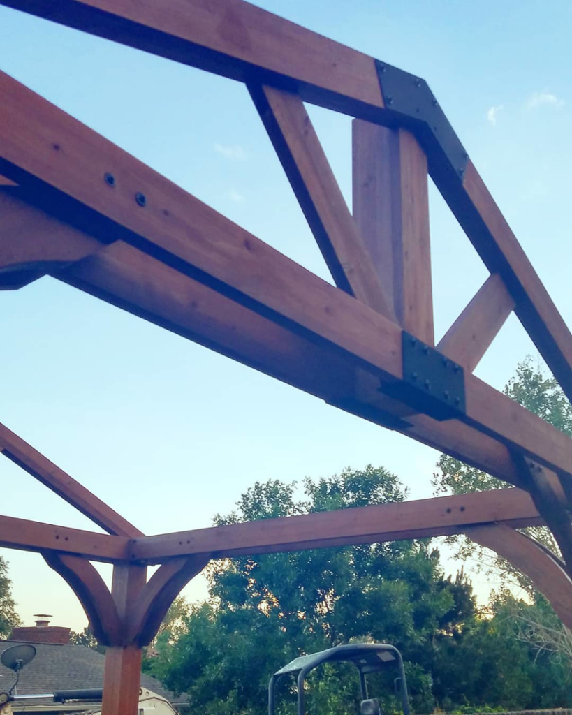 Close-up of the sturdy wooden frame and metal connectors of a gazebo structure built by Steveson Enterprises, Inc. in Golden, CO.