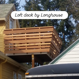 A newly constructed wooden loft deck attached to a house, built by Longhouse Construction Inc. in Estacada, OR.