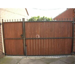 A newly installed wooden gate with a metal frame, a service provided by Chicago Service Source Inc in Chicago, IL