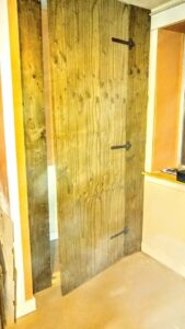 New wooden paneling installed on an interior wall by Shane's Handyman Service in Edmond, OK.