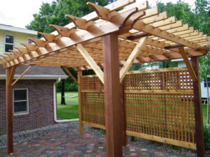 A newly constructed wooden pergola over a patio by The Home Pros in Virginia Beach, VA