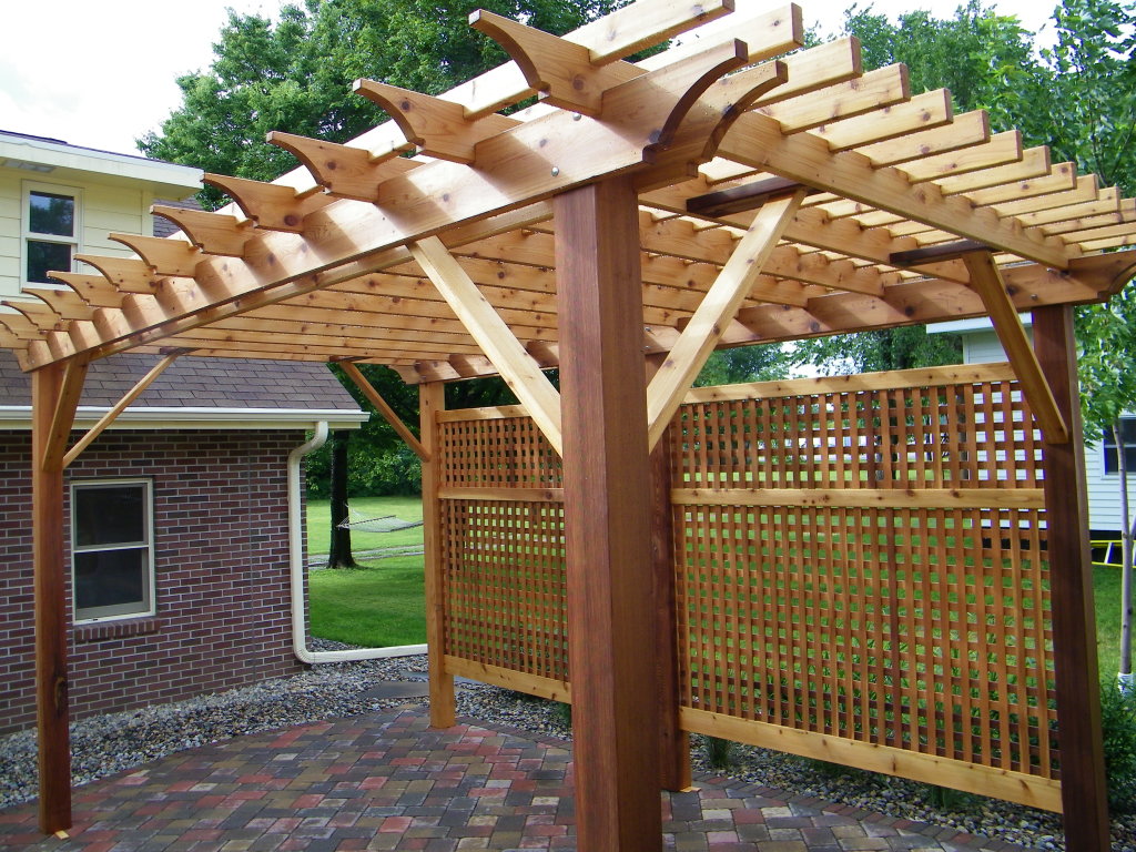 A newly constructed wooden pergola over a patio by The Home Pros in Virginia Beach, VA