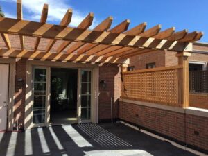 A newly constructed wooden pergola and deck area, built by Chicago Service Source Inc in Chicago, IL