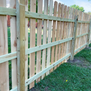 Detailed view of a newly constructed wooden picket fence by Cutting Edge Contracting and Handyman in Minneapolis, MN.