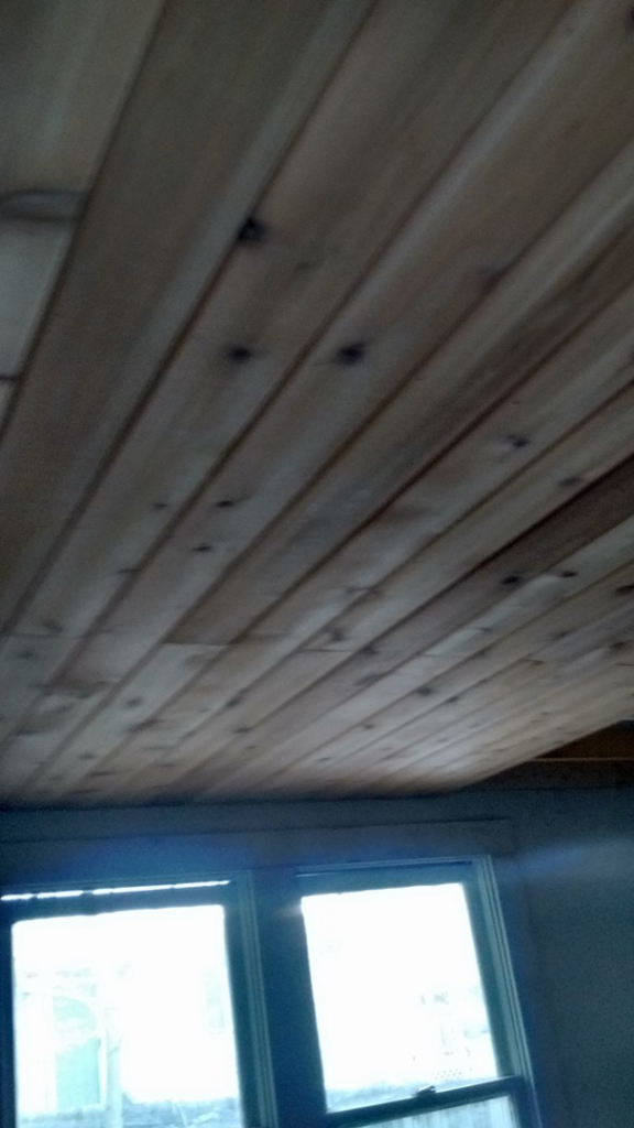 A newly installed wooden plank ceiling in a room by Fryes Renovation and Improvements in Johnson City, TN.