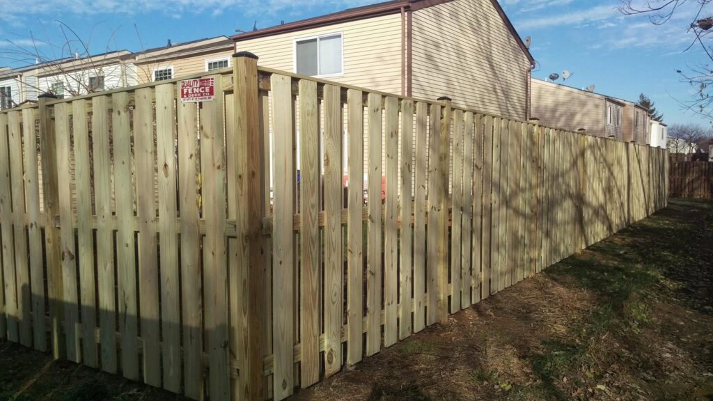 A newly installed wooden privacy fence by Quality Fence & Deck Co. in Frederick, MD.