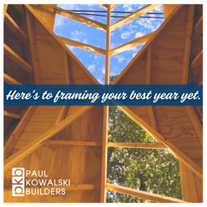 A wooden roof framing structure under construction by Paul Kowalski Builders in Charlotte, NC.