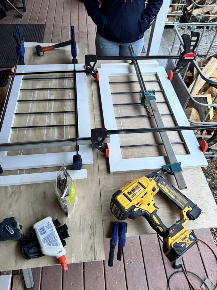 A woodworking project in progress with clamps and a nail gun by Premier Handyman Services in Lexington, KY.