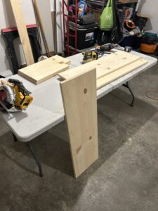 Woodworking project materials and tools laid out on a table, showing work by Rockin & Rollin Handyman Services in North Ogden, UT.