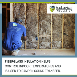 A worker installing fiberglass insulation in a wall for EcoLogical Insulation - Birmingham, AL.