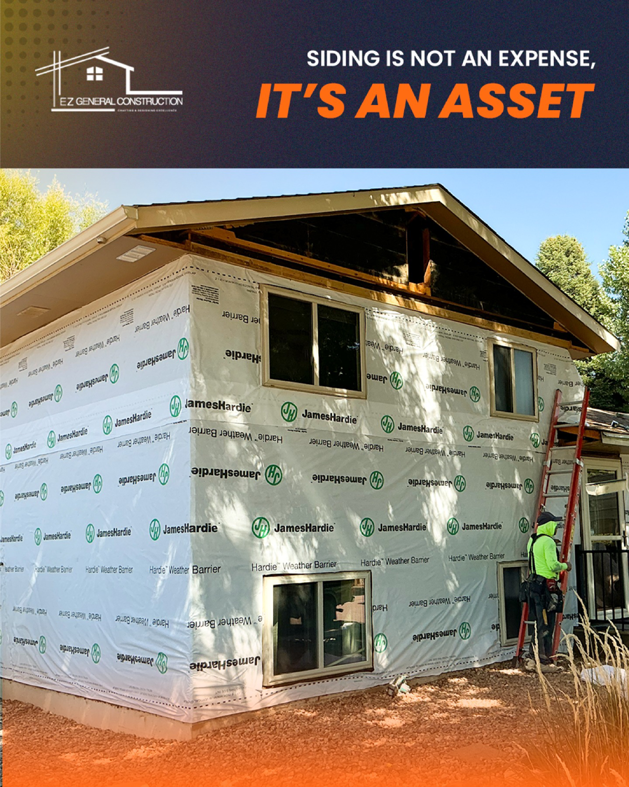 A worker on a ladder installing new siding and weather barrier on a house for EZ General Construction LLC in Colorado Springs, CO