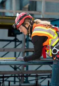 A worker measuring a metal beam for a handyman project at Alberici Corporation in St. Louis, MO.