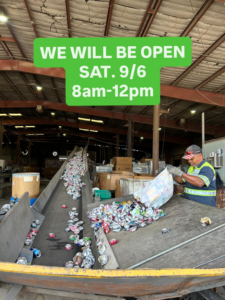 A worker sorting aluminum cans on a conveyor belt at Great Northwest Recycling in San Antonio, TX