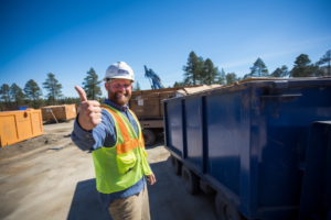 A worker gives a thumbs up next to a full dumpster of junk at a job site for Dumpster Rental Champs Austin, TX.