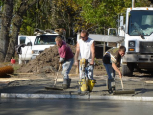 Workers finishing a concrete surface for Central Illinois Construction Services Inc. in Effingham, IL