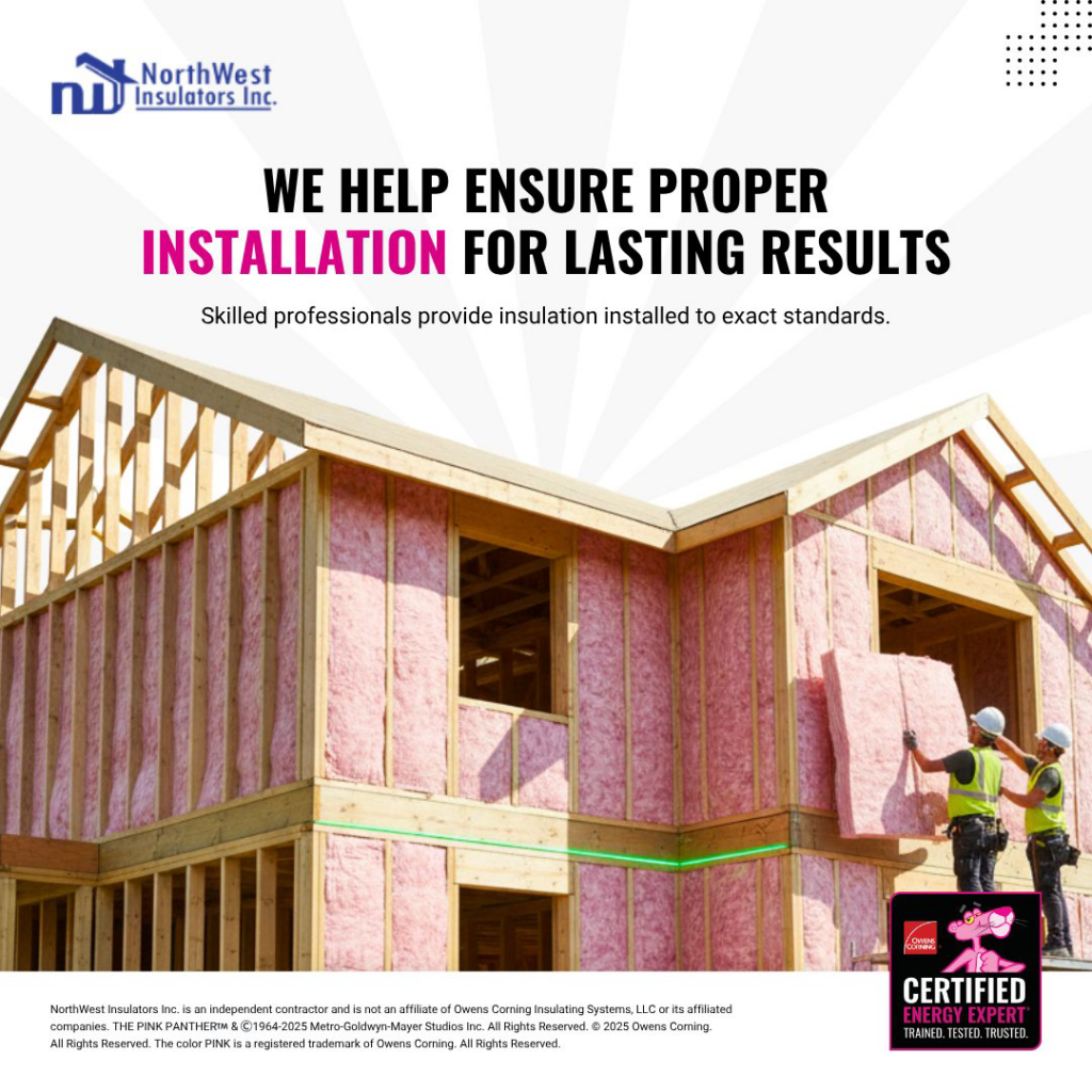 Two workers installing pink fiberglass insulation in a new home construction at Northwest Insulators Inc in Salem, OR.