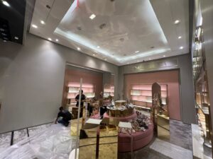 Workers installing new fixtures and shelving in a retail store for Vegas Valley Remodeling/Handy-Man Services in Las Vegas, NV.