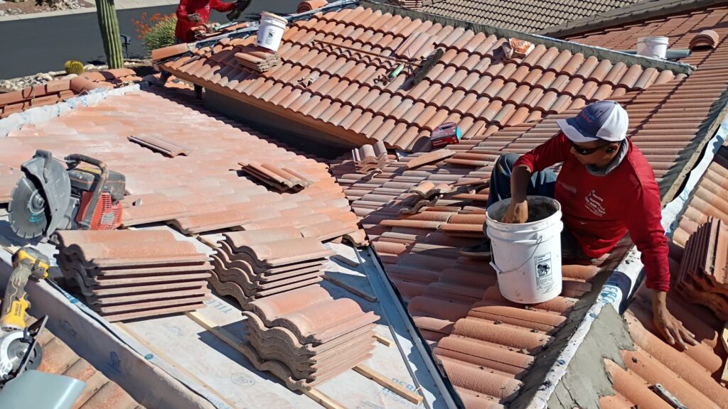 Skilled handymen from Mayitos roofing LLC installing a new tile roof in Tucson, AZ.