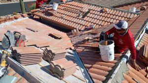 Skilled handymen from Mayitos roofing LLC installing a new tile roof in Tucson, AZ.