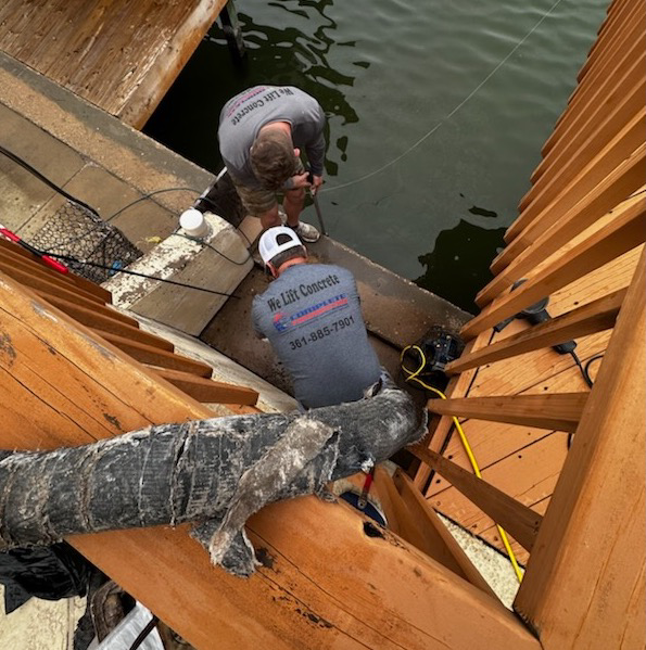 Workers performing concrete lifting and dock repair services for Complete Foundation Repairs in Corpus Christi, TX.