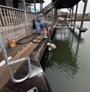 Workers performing dock repair and maintenance for Complete Foundation Repairs in Corpus Christi, TX.