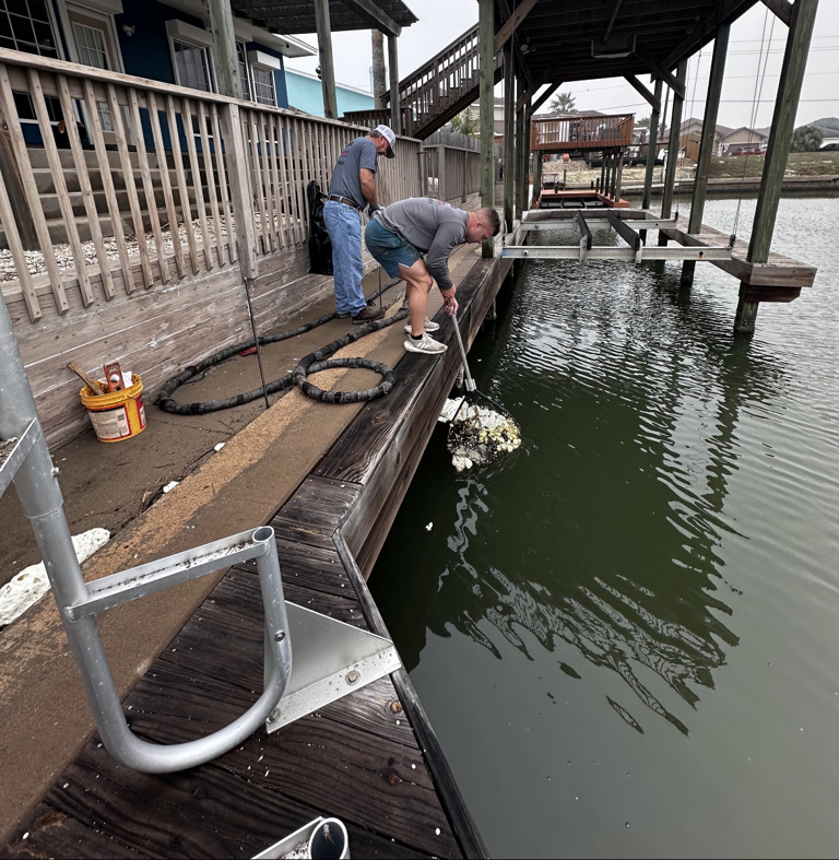 Workers performing dock repair and maintenance for Complete Foundation Repairs in Corpus Christi, TX.