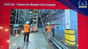 Workers preparing metal poles for commercial chain link fence installation in a warehouse by Memphis Fence Company, LLC in Memphis, TN.