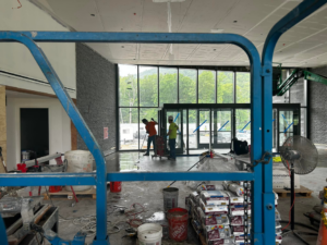 Workers preparing a floor for tile installation at a construction site by BRB Ceramic Tile & Marble in Metuchen, NJ