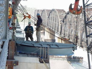 Workers from Tidewater Crane & Contracting rigging a heavy component on a bridge in Virginia Beach, VA
