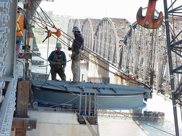 Workers from Tidewater Crane & Contracting rigging a heavy component on a bridge in Virginia Beach, VA