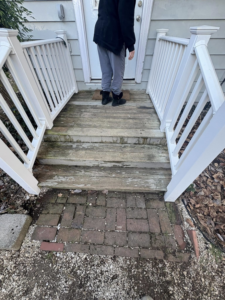 Worn wooden porch steps and railings needing repair by Savage Home Builders in Hodgenville, KY