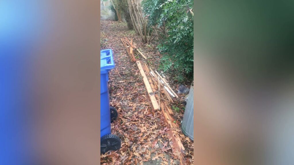 A pile of wooden debris and leaves in a yard, ready for removal by MOAT's Junk Removal LLC in Jonesboro, AR.