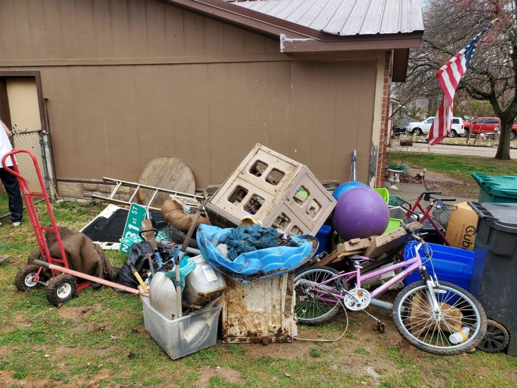 A large yard pile of miscellaneous junk and debris, awaiting removal by Urban Junk Removal, LLC in Springdale, AR.