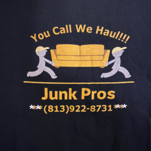 A large pile of tree branches and yard debris on a lawn, ready for removal by Junk Pros Junk Removal in Tampa, FL.