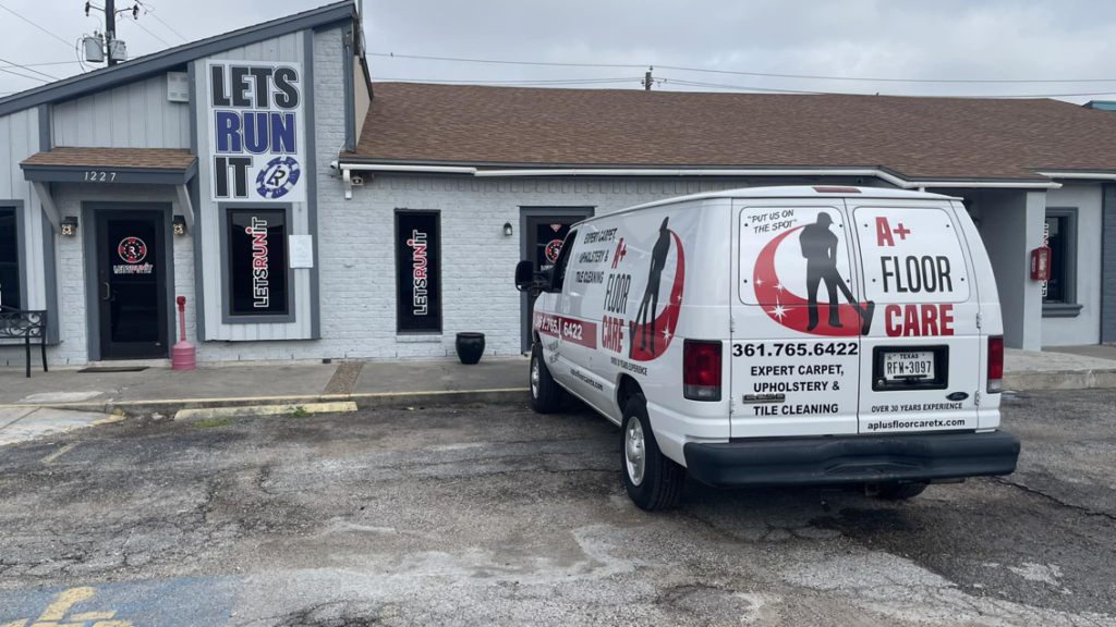 The A+ Floor Care service van parked in front of a business office for a carpet or floor care service in Corpus Christi, TX.