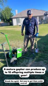 An AB Pest Control technician with gopher control equipment and a shovel in a residential yard in Bakersfield, CA.
