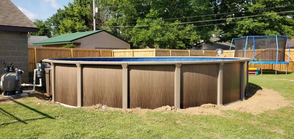 An above-ground pool installation with pump and filter system by Firemaster in Oklahoma City, OK