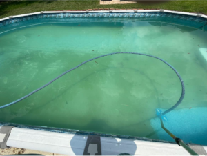 An above-ground swimming pool being vacuumed and cleaned by Brocks Pools LLC in Baton Rouge, LA.