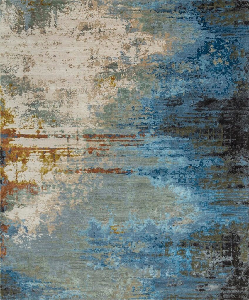 A close-up of an abstract blue, white, and brown patterned rug, available at David Alan Rugs in Austin, TX.