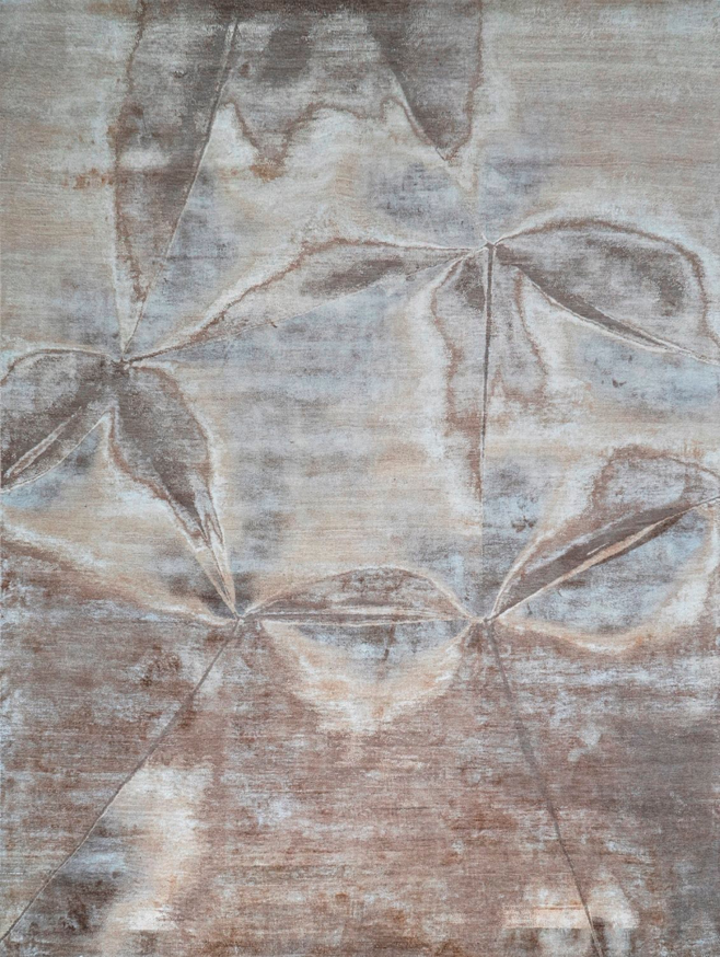 An abstract patterned rug in brown and white tones, available at Organic Looms in Scottsdale, AZ